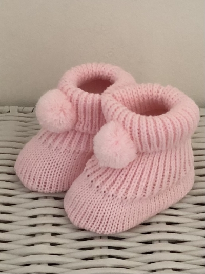 baby pink girls knitted bootees pom poms