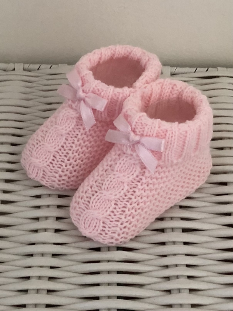 cable knitted pink baby bootees with bow