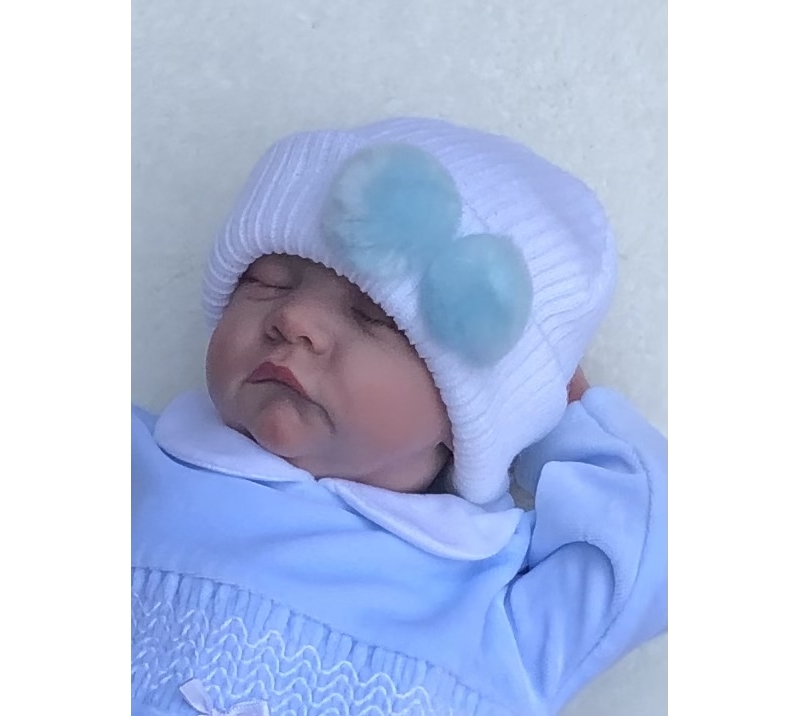 baby boys white knitted hat blue pom poms 