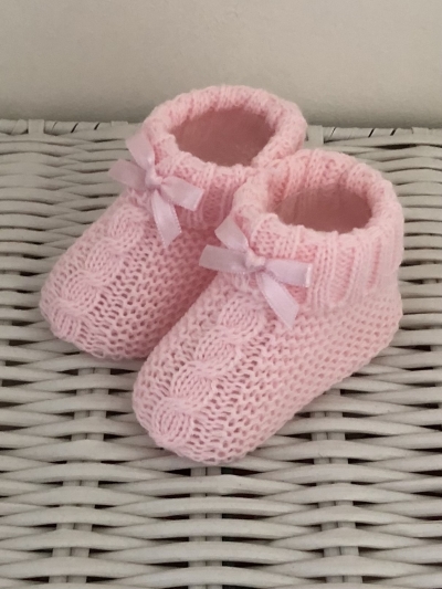cable knitted pink baby bootees with bow