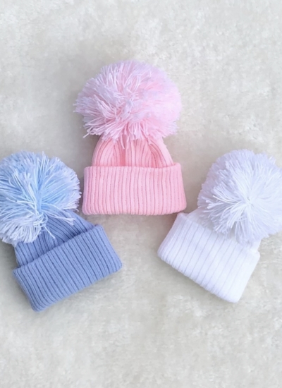 babies knitted pom pom hats pink white blue 